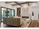 View of a bright and airy living room with hardwood floors, custom built-ins and fireplace at 4976 Concert Ln, Marietta, GA 30066