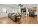 Bright living room featuring hardwood floors, ceiling fan, and built-in bar at 4976 Concert Ln, Marietta, GA 30066