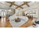 Open-concept living room featuring hardwood floors, staircase, and views of the kitchen at 4976 Concert Ln, Marietta, GA 30066