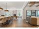 Open-concept living room with hardwood floors, fireplace, and access to the screened-in patio at 4976 Concert Ln, Marietta, GA 30066