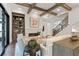 View of a bright and airy living room with hardwood floors, custom built-ins and fireplace at 4976 Concert Ln, Marietta, GA 30066