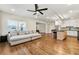 Bright and open living space featuring a kitchen island, comfortable seating, and hardwood floors at 4976 Concert Ln, Marietta, GA 30066