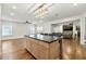 Open living space featuring a kitchen island with seating that flows to the living room at 4976 Concert Ln, Marietta, GA 30066