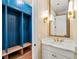 Functional mudroom area with built-in lockers and a stylish vanity at 4976 Concert Ln, Marietta, GA 30066