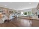 Spacious study with hardwood floors, custom shelves, a window seat, and ample workspace at 4976 Concert Ln, Marietta, GA 30066