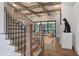 View of an open staircase with hardwood steps, custom iron railings, and hardwood floors at 4976 Concert Ln, Marietta, GA 30066