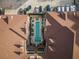 Aerial view of a community pool nestled between rooftops and a parking lot at 77 Peachtree Ne # 507, Atlanta, GA 30309