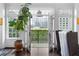 A close view of balcony doors leading to city views with greenery at 77 Peachtree Ne # 507, Atlanta, GA 30309