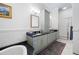Bathroom with double sinks, granite countertops, and a large soaking tub at 77 Peachtree Ne # 507, Atlanta, GA 30309