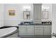 Bathroom with double sinks, granite countertops, and a large soaking tub at 77 Peachtree Ne # 507, Atlanta, GA 30309