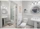 Bright bathroom with two pedestal sinks and a walk-in shower at 77 Peachtree Ne # 507, Atlanta, GA 30309