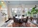 Cozy dining room with an area rug and plenty of sunshine coming through the windows at 77 Peachtree Ne # 507, Atlanta, GA 30309