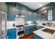 Stylish kitchen with modern, stainless steel appliances and a blue finish on cabinets at 77 Peachtree Ne # 507, Atlanta, GA 30309