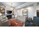 Comfortable living room featuring built in shelving and a fireplace, perfect for relaxing and entertaining guests at 77 Peachtree Ne # 507, Atlanta, GA 30309