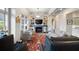 Cozy living room with a fireplace, built-in shelves, comfortable seating, and a large window at 77 Peachtree Ne # 507, Atlanta, GA 30309