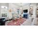 Charming living room with a fireplace, large windows, and built-in shelving, offering style and comfort at 77 Peachtree Ne # 507, Atlanta, GA 30309