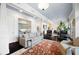 Expansive living space with dark hardwood floors, views into the dining room, and abundant natural light at 77 Peachtree Ne # 507, Atlanta, GA 30309