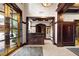 Elegant lobby with dark wood paneling, tile flooring, and a reception desk at 77 Peachtree Ne # 507, Atlanta, GA 30309