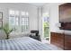 Bedroom with a balcony overlooking a serene outdoor space at 77 Peachtree Ne # 507, Atlanta, GA 30309