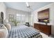Bright bedroom with a checked comforter, shutters, and a blue painted ceiling at 77 Peachtree Ne # 507, Atlanta, GA 30309