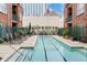 Relaxing swimming pool with lounge chairs and a cityscape backdrop at 77 Peachtree Ne # 507, Atlanta, GA 30309