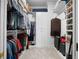 Well-organized walk-in closet features ample shelving, hanging space, and carpeted flooring at 77 Peachtree Ne # 507, Atlanta, GA 30309