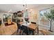 A dining room area featuring hardwood floors with a view to the kitchen at 1168 Eggleston Sw St, Atlanta, GA 30310