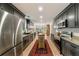 A contemporary kitchen with stainless steel appliances, granite countertops, and hardwood floors at 1168 Eggleston Sw St, Atlanta, GA 30310