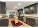 A contemporary kitchen with stainless steel appliances, granite countertops, and hardwood floors at 1168 Eggleston Sw St, Atlanta, GA 30310