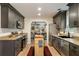 A contemporary kitchen with stainless steel appliances, granite countertops, and hardwood floors at 1168 Eggleston Sw St, Atlanta, GA 30310