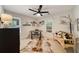 A sunny home office features neutral paint, modern ceiling fan, and decoratively appointed walls at 1168 Eggleston Sw St, Atlanta, GA 30310