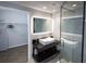 Modern bathroom with a sleek vanity, glass shower and walk-in closet at 2161 Peachtree Ne Rd # 605, Atlanta, GA 30309