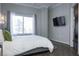 Bedroom featuring a window and a TV on the wall at 2161 Peachtree Ne Rd # 605, Atlanta, GA 30309