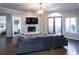 Comfortable bedroom with hardwood floors, a large window, and double doors to the outside at 2161 Peachtree Ne Rd # 605, Atlanta, GA 30309