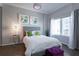 Bedroom features a comfortable bed, bedside table and two pieces of artwork at 2161 Peachtree Ne Rd # 605, Atlanta, GA 30309