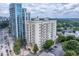 View of the high-rise condo building with balconies and city skyline in the background at 2161 Peachtree Ne Rd # 605, Atlanta, GA 30309