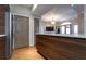 Kitchen view with island, stainless appliances, hardwood floors, and open access to living area at 2161 Peachtree Ne Rd # 605, Atlanta, GA 30309