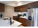 Modern kitchen featuring stainless steel appliances, sleek countertops and wood cabinets at 2161 Peachtree Ne Rd # 605, Atlanta, GA 30309