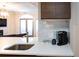 Open-concept area highlighting the kitchen counter, adjacent living room and recessed lighting at 2161 Peachtree Ne Rd # 605, Atlanta, GA 30309