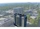Overhead shot of the high-rise apartment building highlighting its architectural design and green surroundings at 3040 Peachtree Nw Rd # 511, Atlanta, GA 30305
