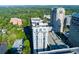 Stunning aerial view of high-rise apartment building complex in a lush, green urban setting at 3040 Peachtree Nw Rd # 511, Atlanta, GA 30305