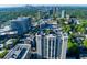 Expansive aerial view showcases the apartment building in a vibrant urban landscape with city views at 3040 Peachtree Nw Rd # 511, Atlanta, GA 30305