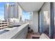 Balcony with a view of downtown buildings and a covered parking lot at 3040 Peachtree Nw Rd # 511, Atlanta, GA 30305