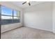 Clean, carpeted bedroom with a large window providing natural light and a serene view at 3040 Peachtree Nw Rd # 511, Atlanta, GA 30305