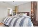 Cozy bedroom features a queen-size bed with plush bedding, soft lighting, and ensuite bathroom access at 3040 Peachtree Nw Rd # 511, Atlanta, GA 30305