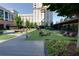 Relaxing common area featuring well-maintained landscaping, outdoor seating, and shade, creating a tranquil environment at 3040 Peachtree Nw Rd # 511, Atlanta, GA 30305