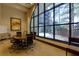 A well-appointed conference room featuring large windows, a round table, and comfortable seating for business meetings at 3040 Peachtree Nw Rd # 511, Atlanta, GA 30305
