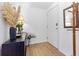 Hallway with a wooden coat rack, console table, and wood-style floors at 3040 Peachtree Nw Rd # 511, Atlanta, GA 30305