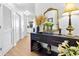 Foyer decorated with a large mirror, black console, and white floors at 3040 Peachtree Nw Rd # 511, Atlanta, GA 30305