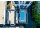 Aerial shot of the condo building's pool, surrounded by lounge chairs and lush greenery, with an adjacent parking area at 3040 Peachtree Nw Rd # 511, Atlanta, GA 30305